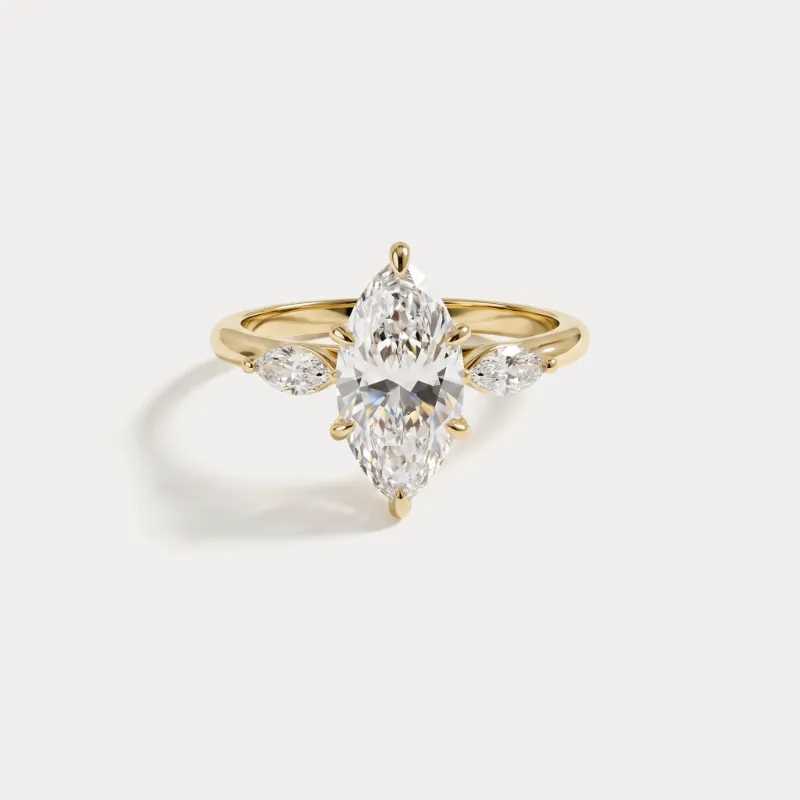 Leonids marquise ring with a pointed oval gemstone centerpiece on a polished band