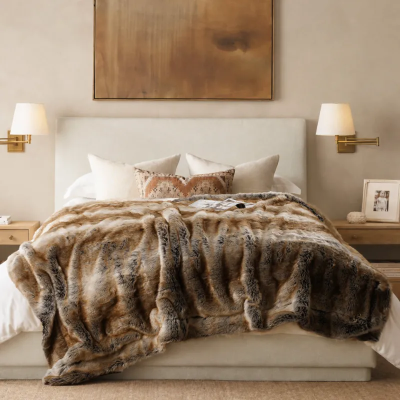 Battilo Home faux fur blanket draped over a chair, soft plush texture visible