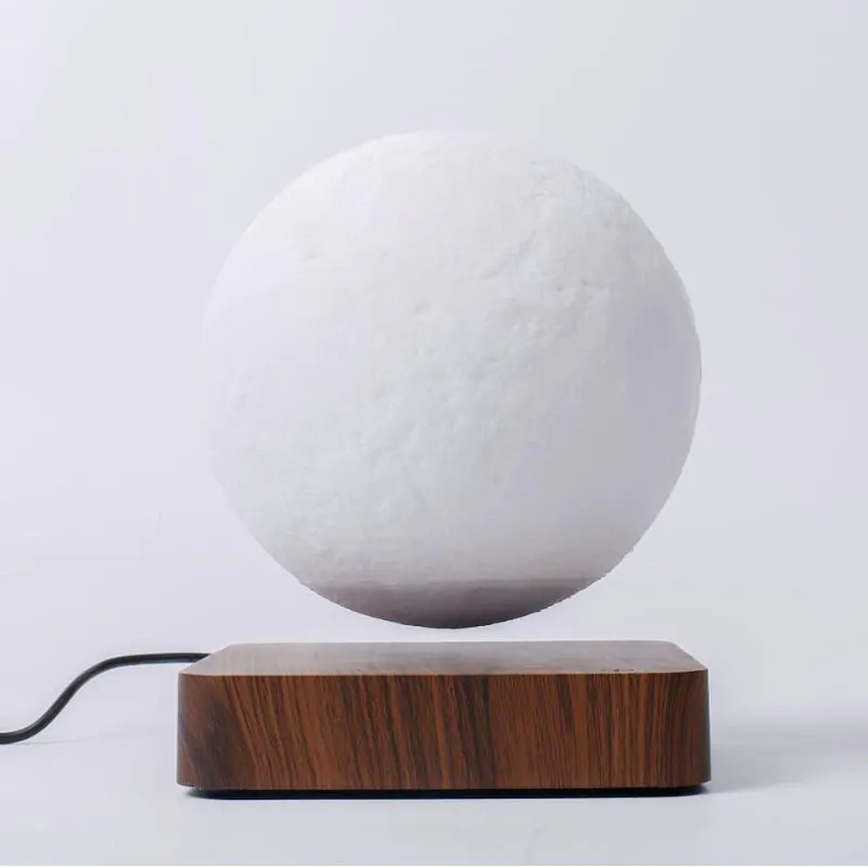 The Original Moon Lamp levitating moon lamp floating above magnetic base